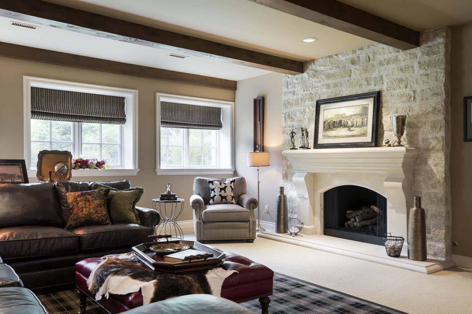 Elegant living room with fireplace, large windows, and stylish furniture in Wichita, Kansas.